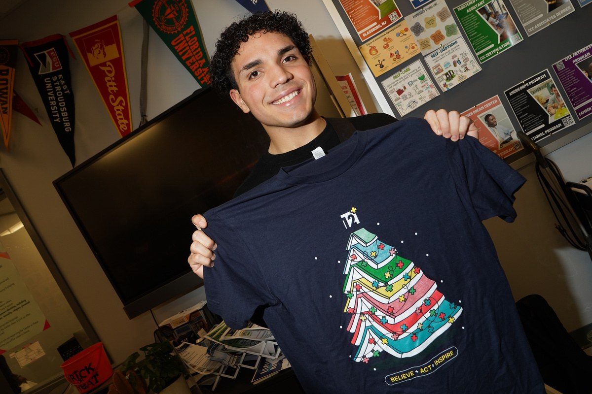 Students and staff in 12 Plus holiday shirts
